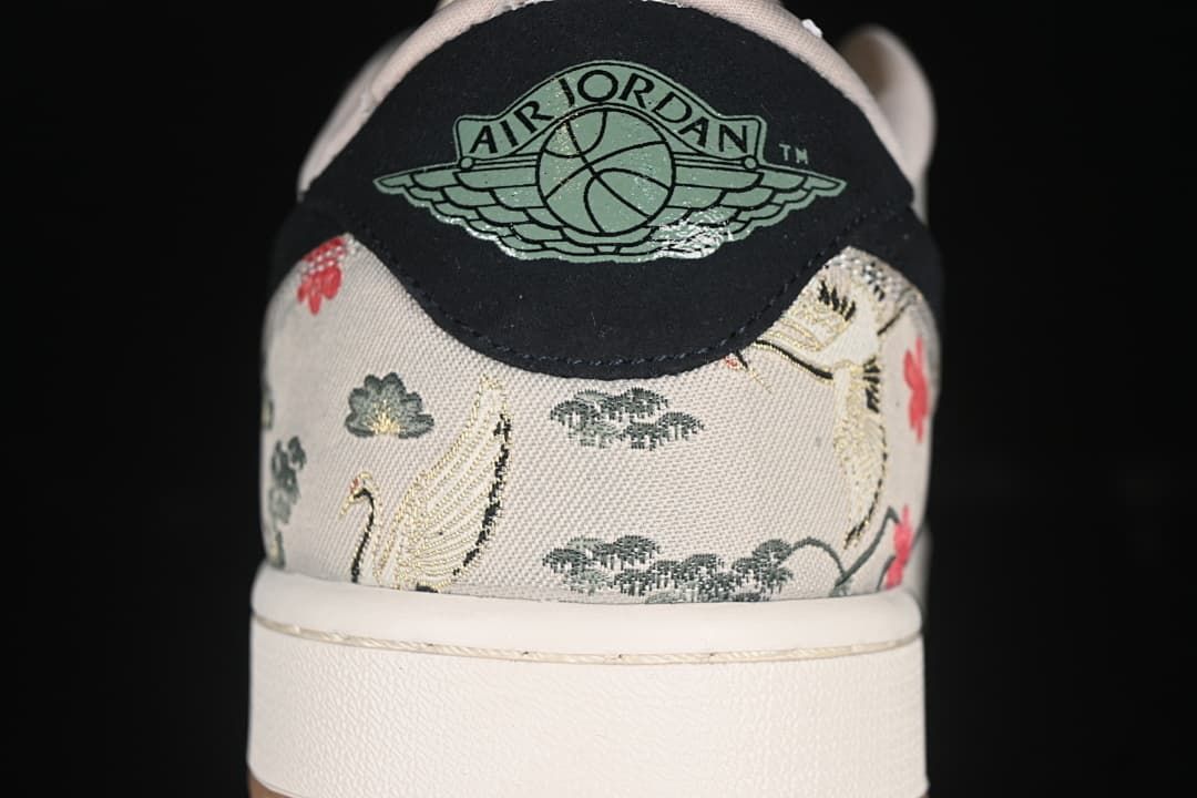 Rear view showing the Air Jordan Wings logo and patterned heel