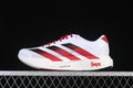 Side view of white Adidas Adizero Evo SL shoes with red and black stripes and Nebraska graphics