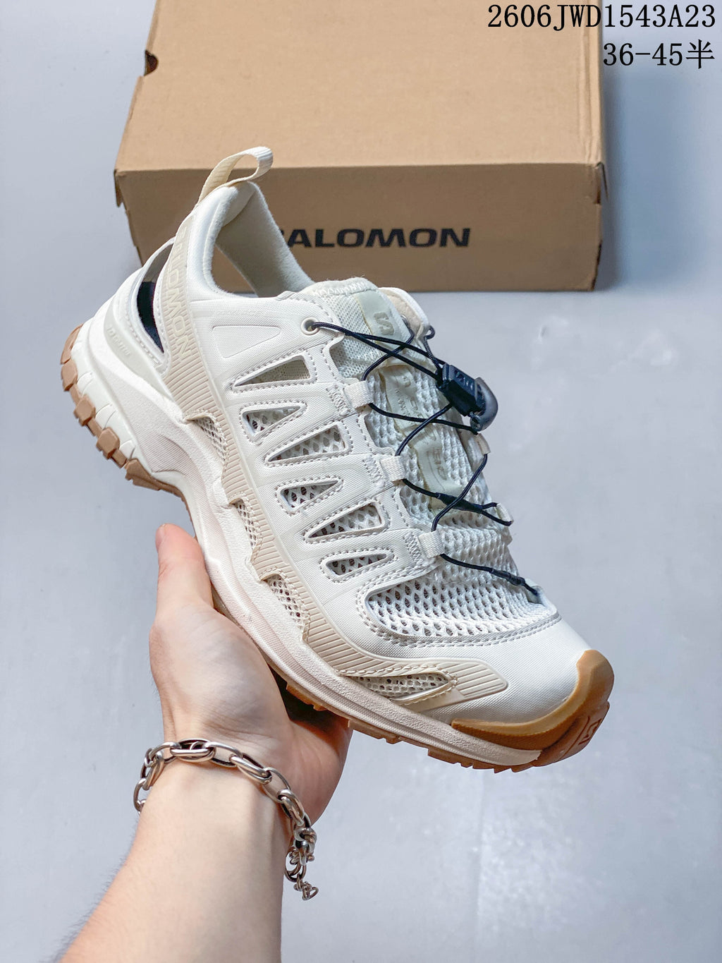 Side view of an off-white Salomon XA Pro 3D Amphib sneaker with cord closure