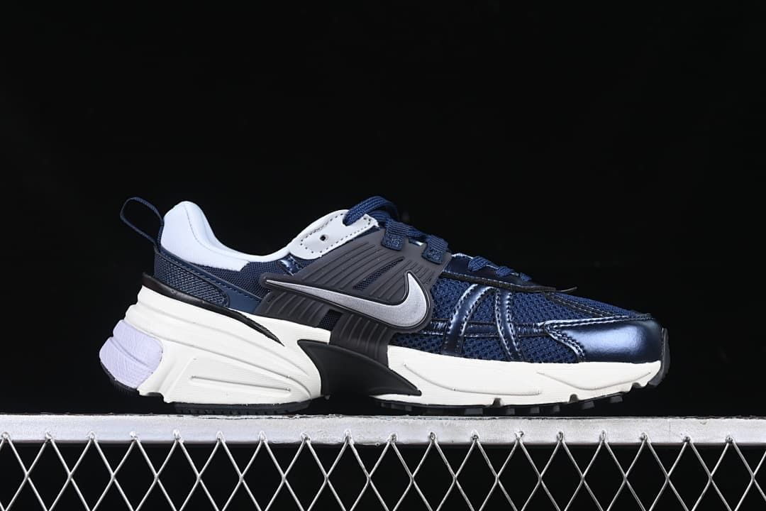 Side view of the navy and white sneaker