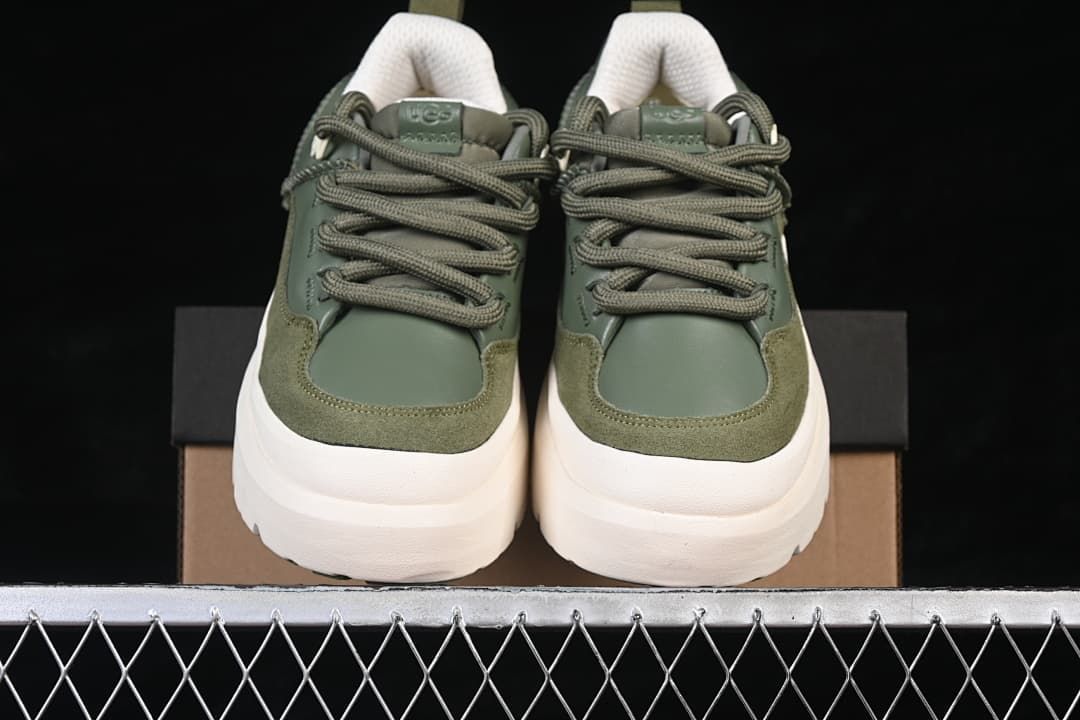 Front view of the pair showing green uppers, laces and chunky off-white soles