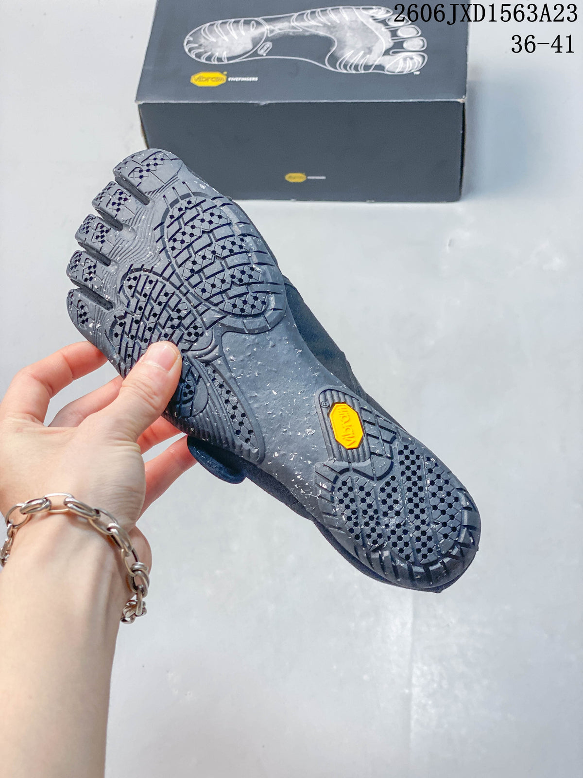 Close-up of the patterned outsole on a gray FiveFingers-style shoe