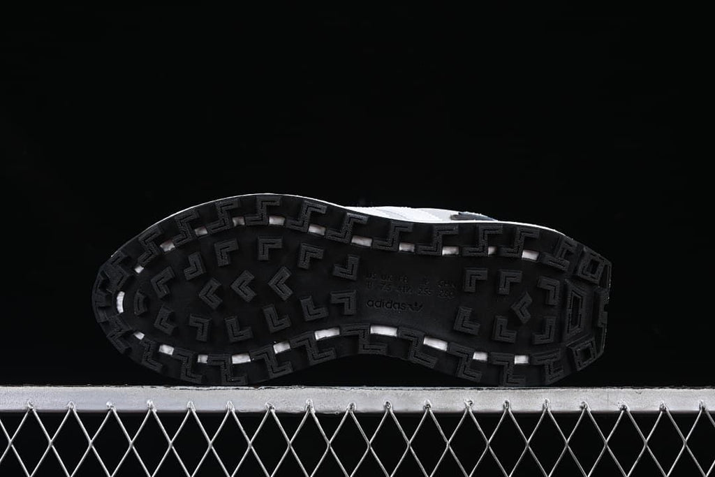 Underside view showing the black patterned outsoles