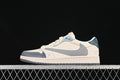 Side view of off-white and gray low-top sneakers with an iridescent eyelet panel and dark teal heel detail.