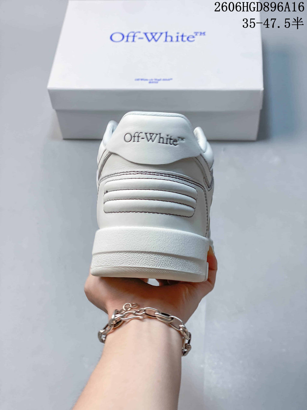 Rear view of the sneaker showing heel stitching and branding