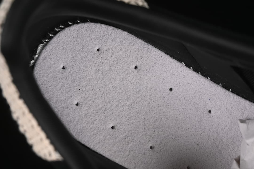 Close-up inside the shoe showing the light-colored footbed.
