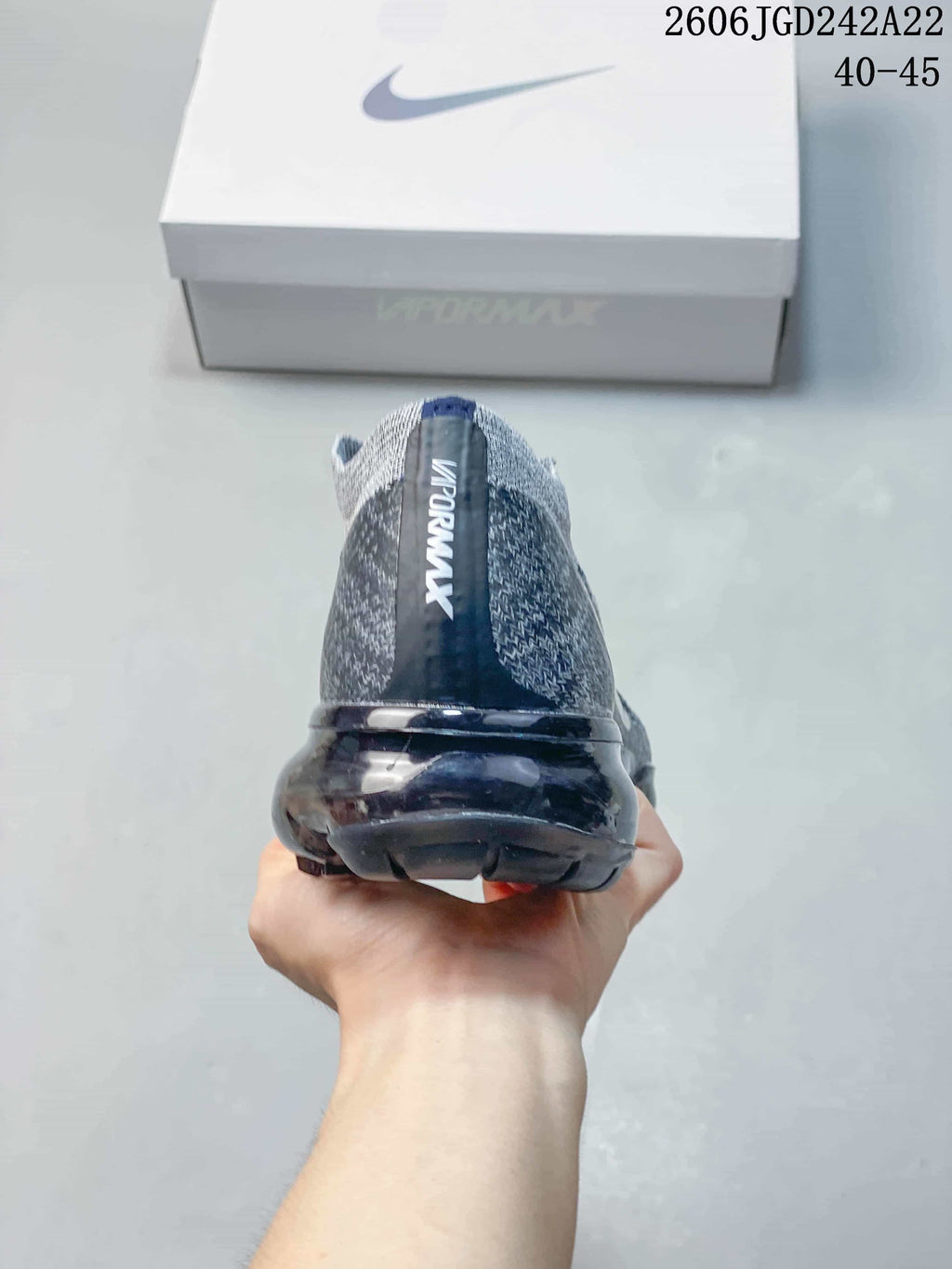 Rear view of the gray Nike VaporMax Flyknit sneaker with a translucent sole
