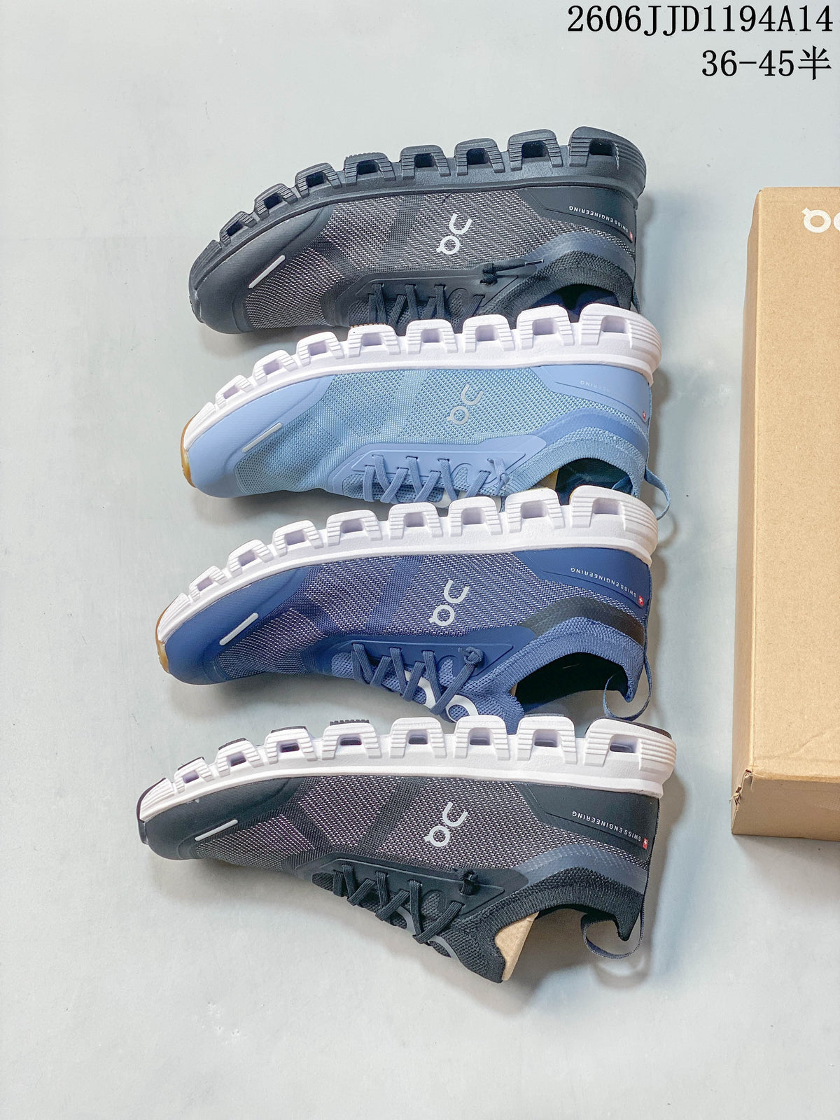 Overhead view of blue and gray On Cloud 6 Versa shoes showing their segmented soles