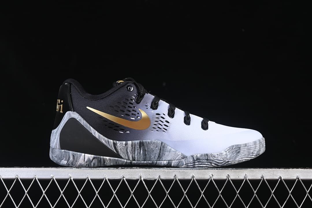 Side profile of the shoe with gold Swoosh and marbled gray sole