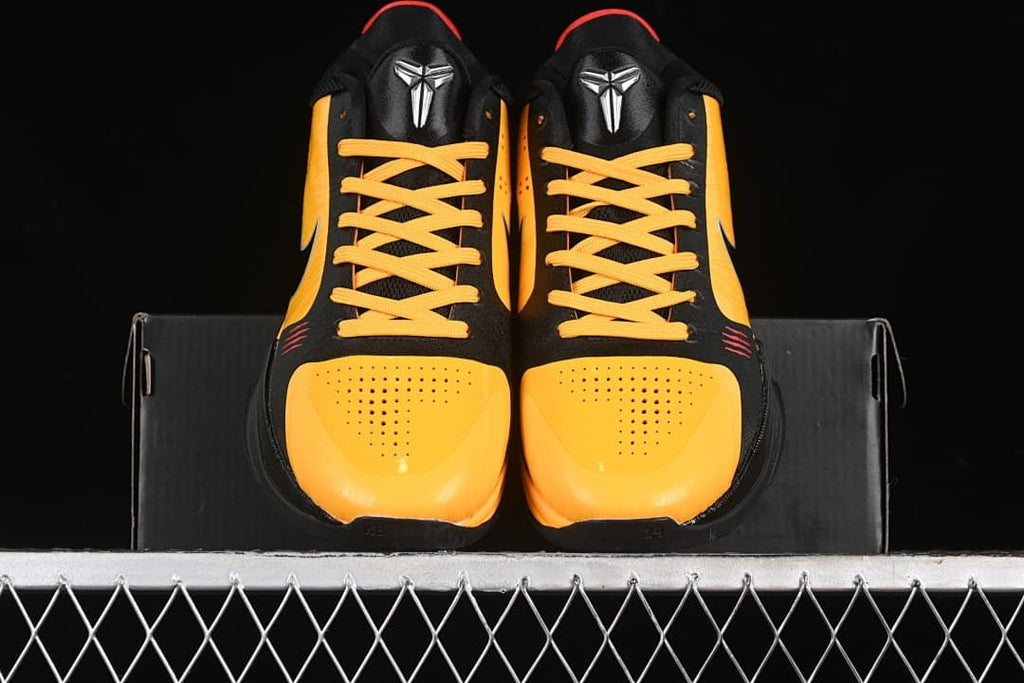 Front view of the pair showing yellow perforated toe panels