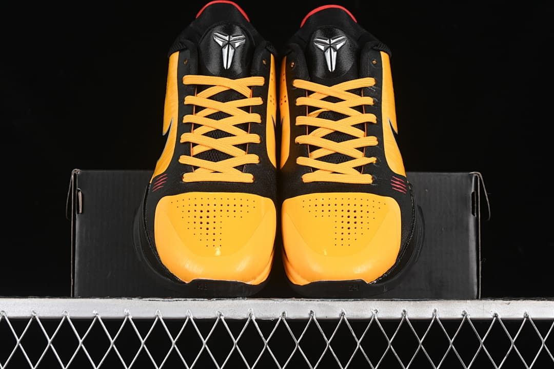 Front view of the pair showing yellow perforated toe panels