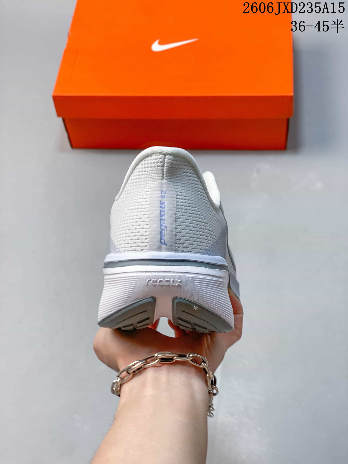 Rear view of the white Nike Pegasus 42 shoe with grey heel details