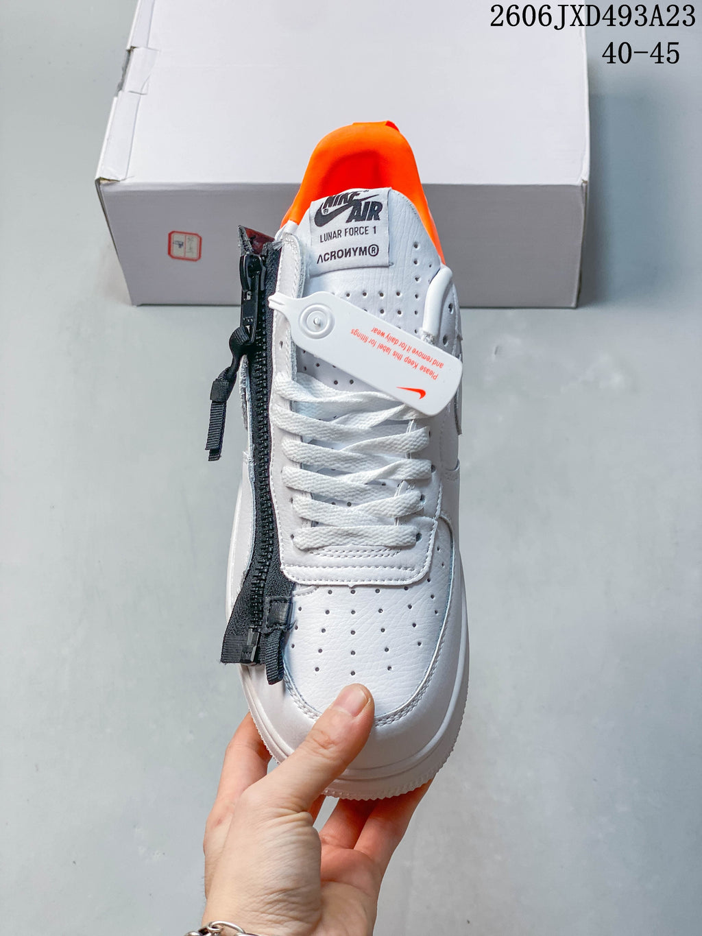 Top view showing white laces, perforated toe, and black zipper-style side trim