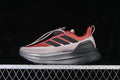 Side view of red and gray adidas Ultraboost 5 running shoe with black stripes
