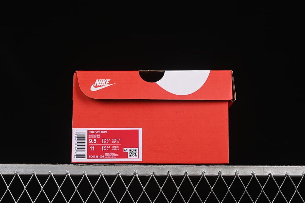 Red sneaker box with a label identifying Nike V2K Run and style FD0736-009