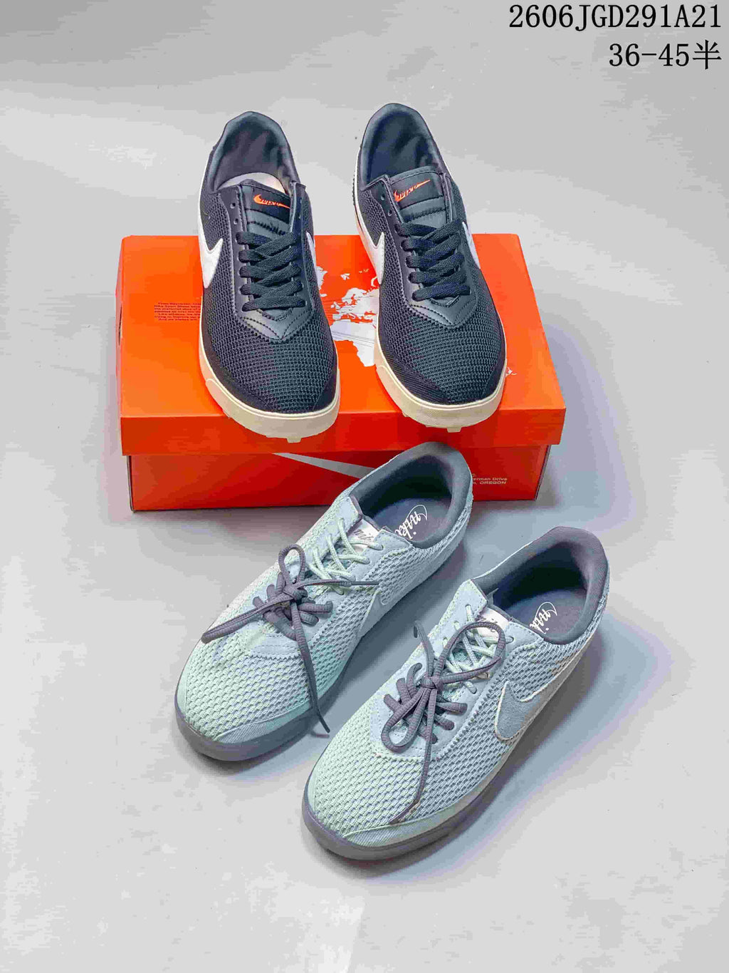 Dark navy and pale blue-gray Nike low-top sneakers shown together.