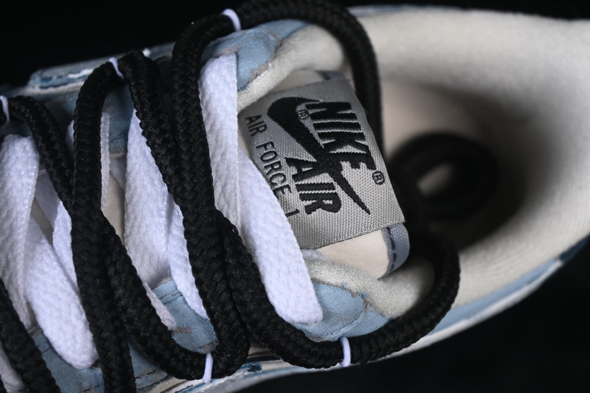 Close-up of the shoe tongue, branding and contrasting black and white laces
