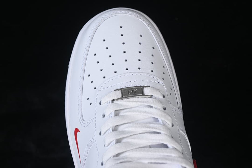 Top-down detail of the perforated toe box, laces, and lace tag.