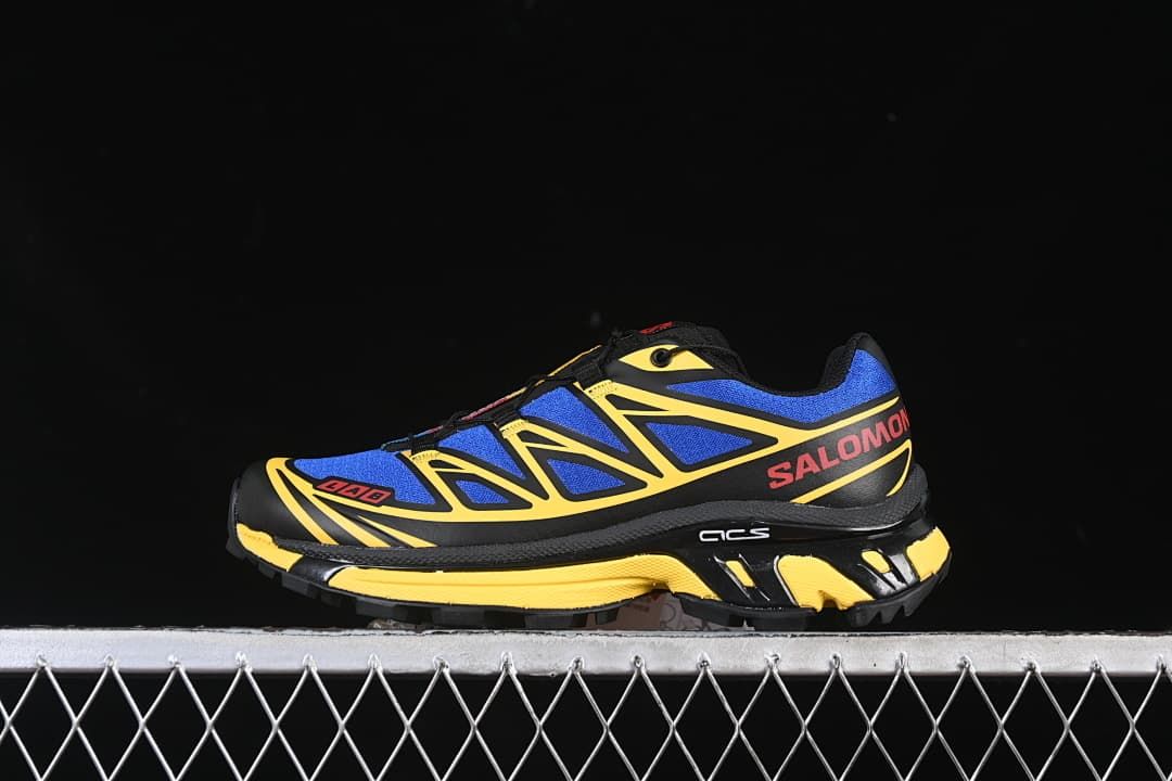 Side view of blue, yellow, and black Salomon XT-6 sneaker