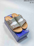 Gray Birkenstock Arizona sandals shown on a blue shoe box