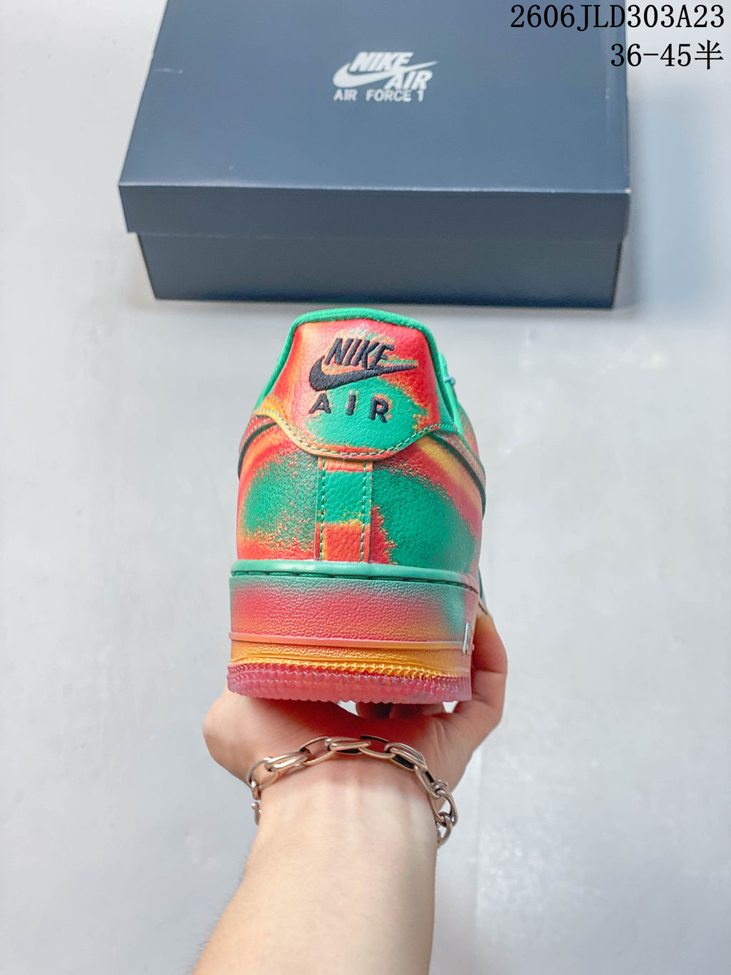 Rear view of the green and coral Nike Air Force 1 sneaker with a multicolor sole