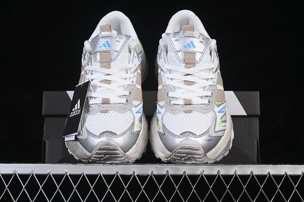 Front view of the pair showing the mesh-look toe panels and lace-up design.