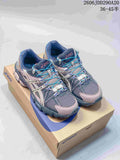 Pair of gray and pink ASICS Gel-Kahana 8 shoes with turquoise laces on a shoe box.