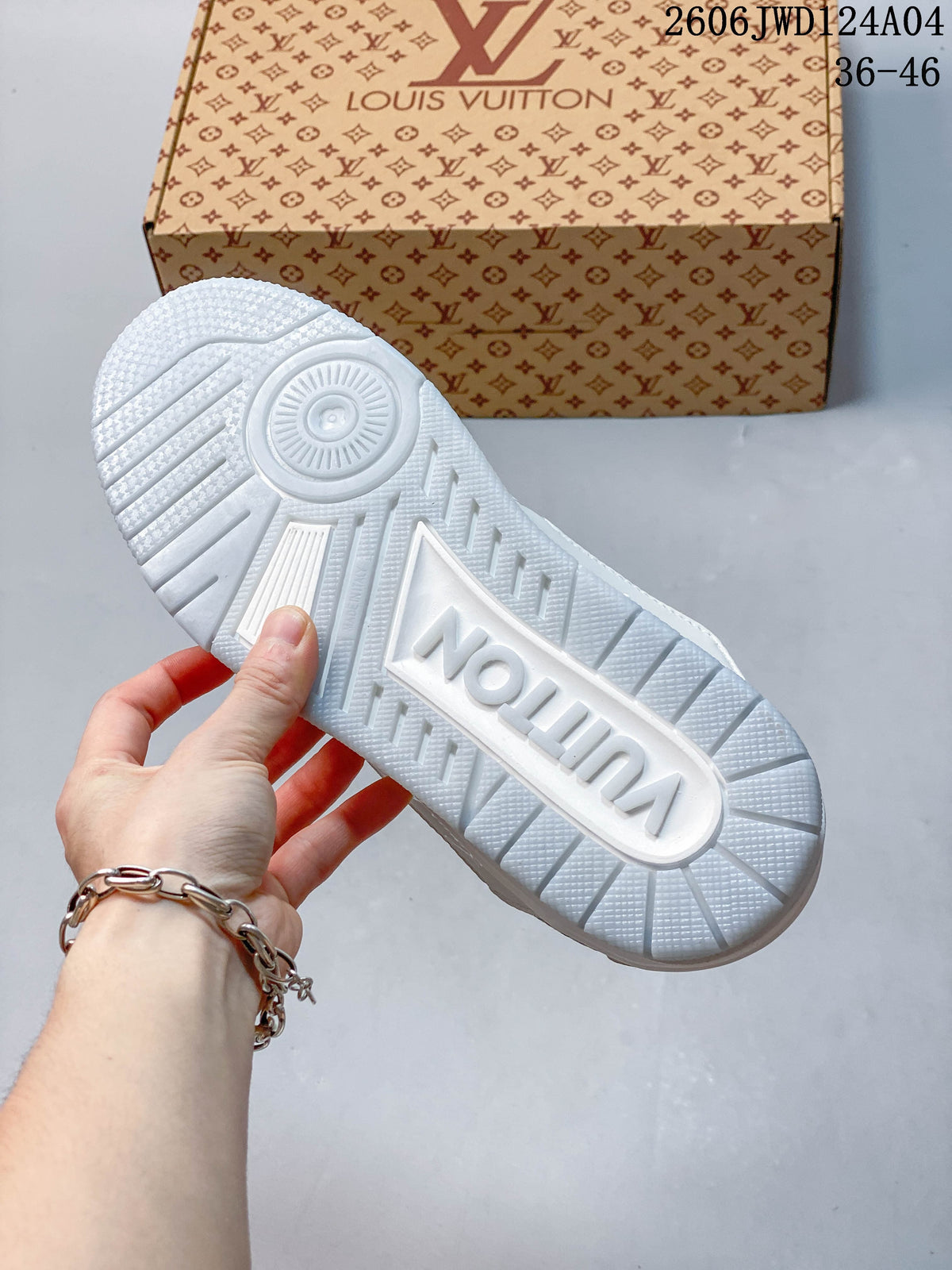 Close-up of the white textured sneaker outsole with molded lettering, with a patterned box in the background.