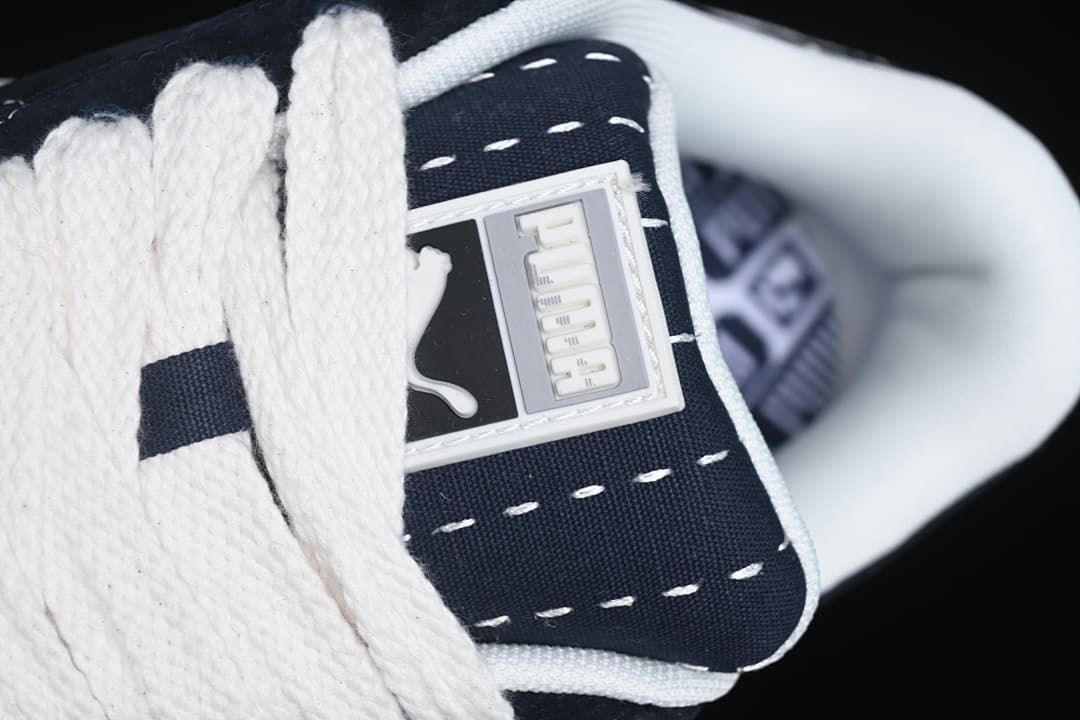 Close-up of the tongue badge and thick white laces