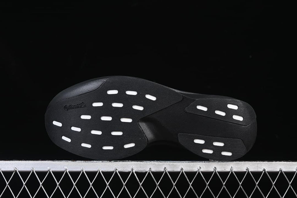 Underside view showing the black outsole and white traction details.