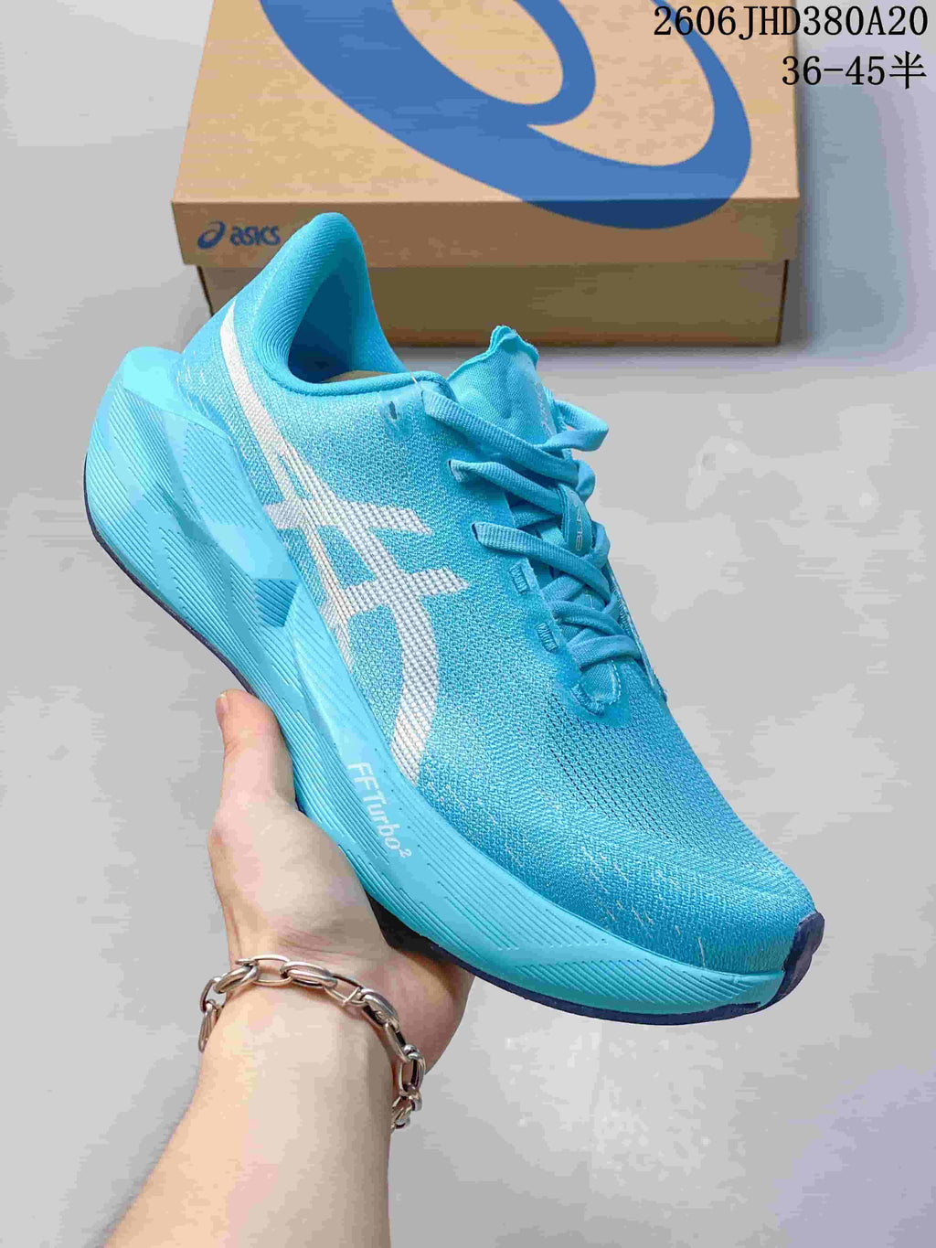 Angled side view of the blue running shoe with white ASICS detailing