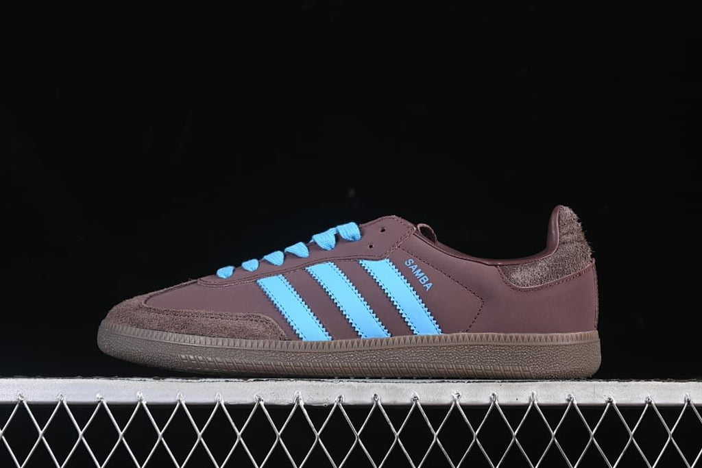 Side profile of the brown Samba OG sneaker with bright blue details.
