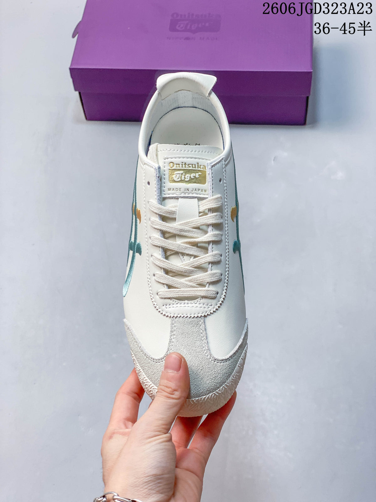 Top view of the laces and suede-look toe overlay on an ivory Mexico 66 NM sneaker