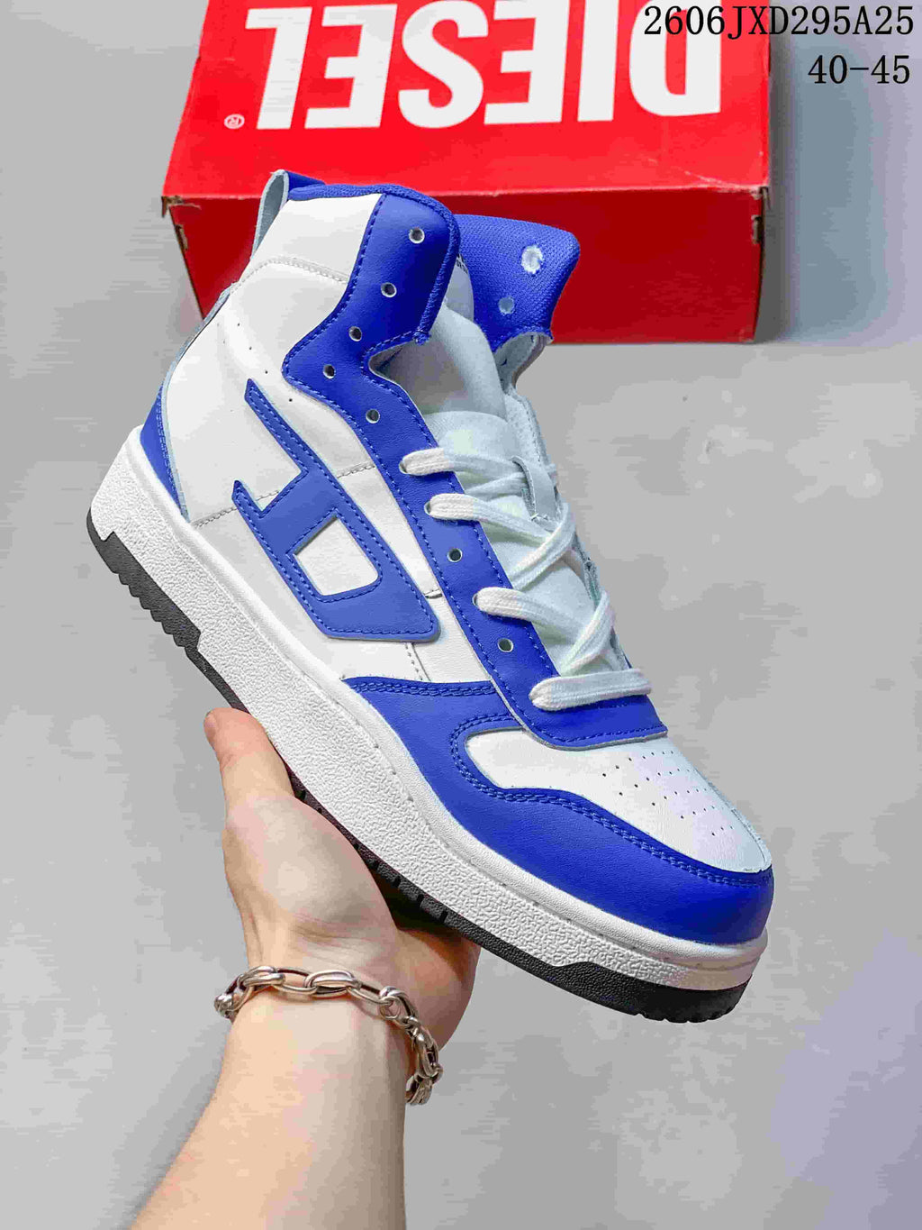White Diesel S-Ukiyo high-top sneaker with vivid blue accents.