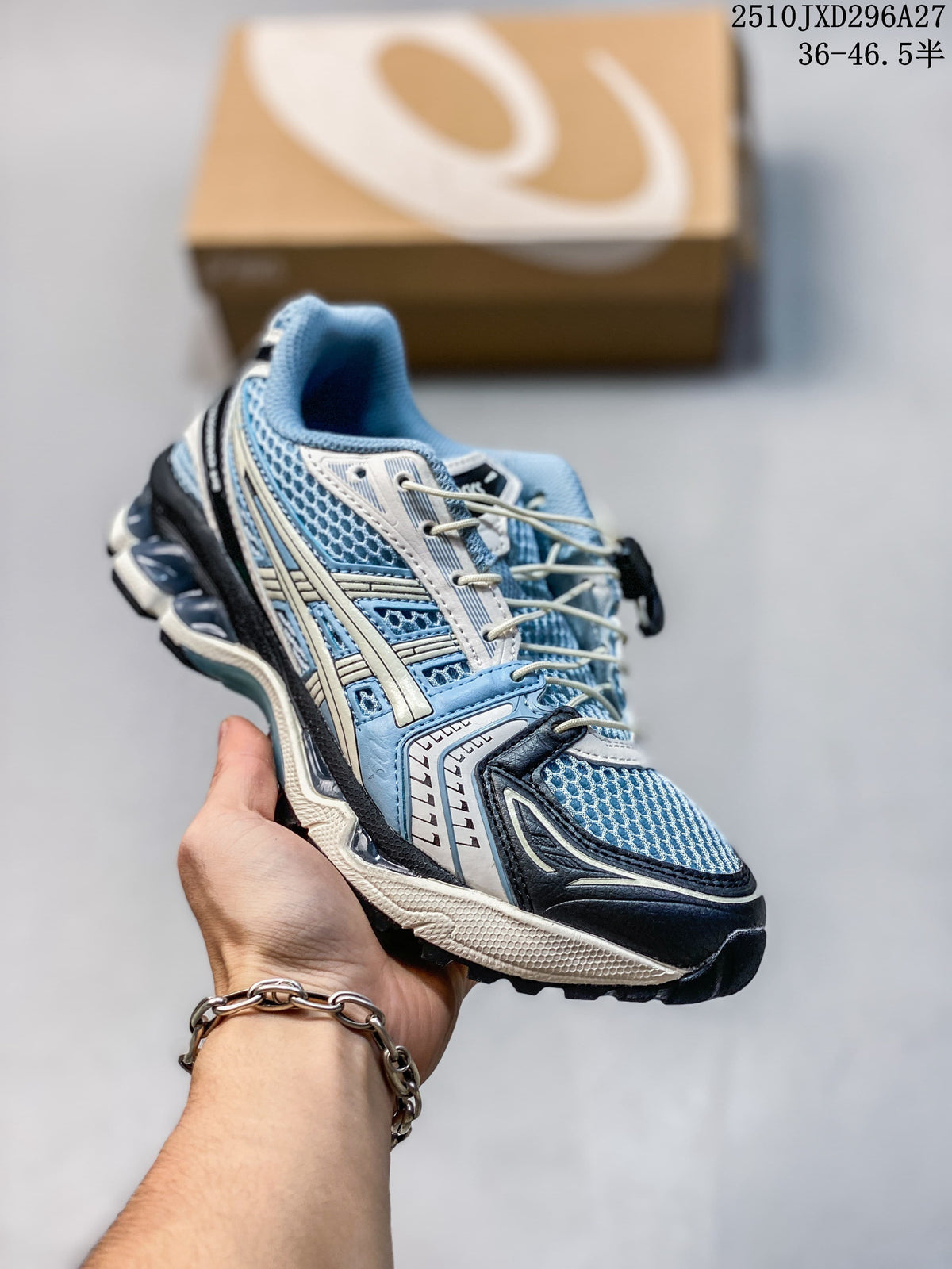 Light blue and silver mesh sneaker with dark overlays, held in hand.