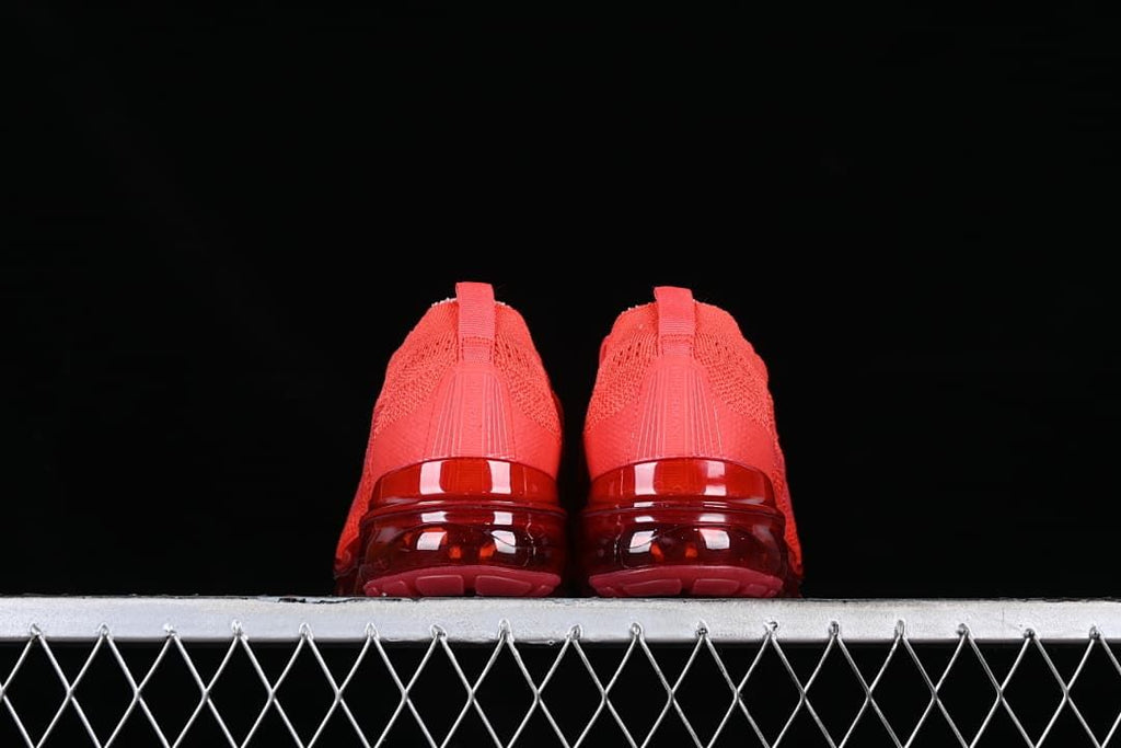 Rear view of the pair showing heel details and translucent soles