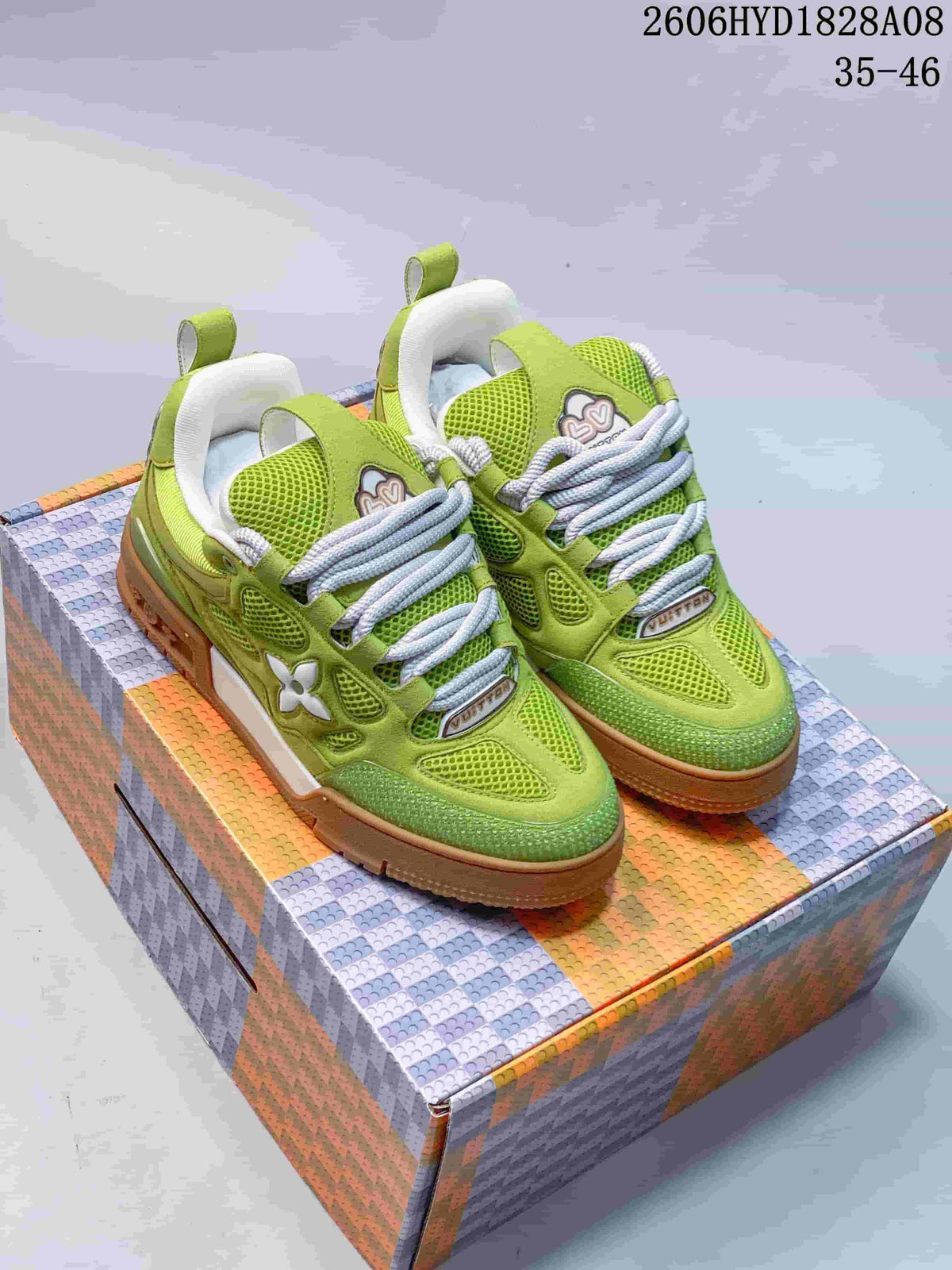 Pair of lime-green Louis Vuitton Trainer sneakers with white laces and gum-colored soles