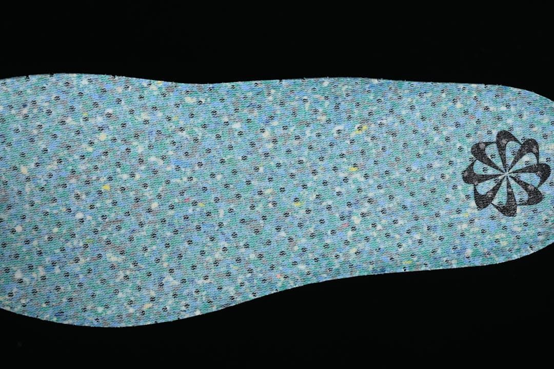 Reverse side of a blue-green patterned shoe insert
