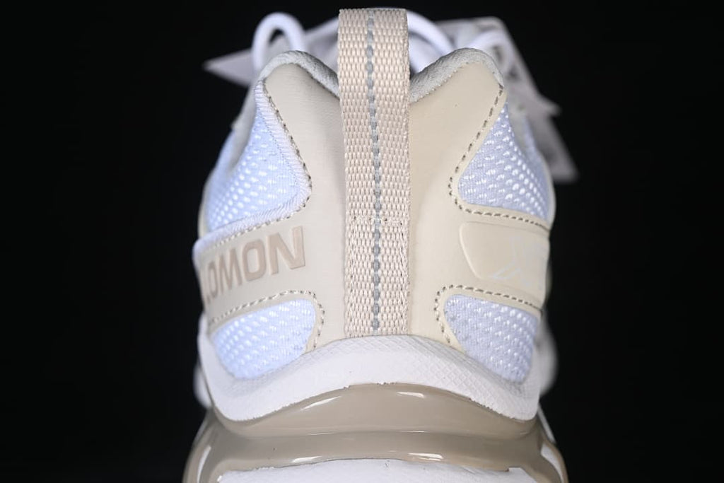 Rear view showing the heel pull tab and mesh panels.