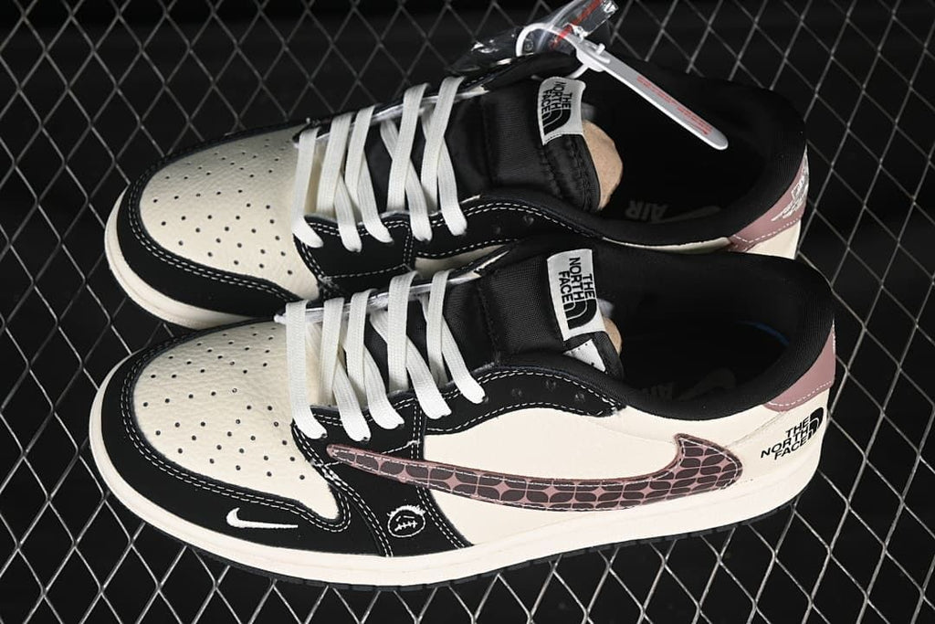 Pair of cream and black low-top sneakers viewed from above, showing white laces, patterned Swooshes, and tongue labels.