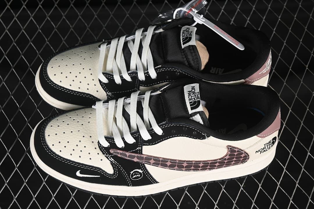 Pair of cream and black low-top sneakers viewed from above, showing white laces, patterned Swooshes, and tongue labels.