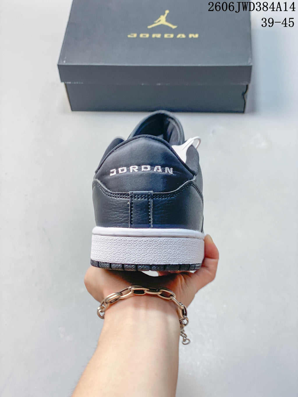 Rear view showing the Jordan wordmark and white midsole