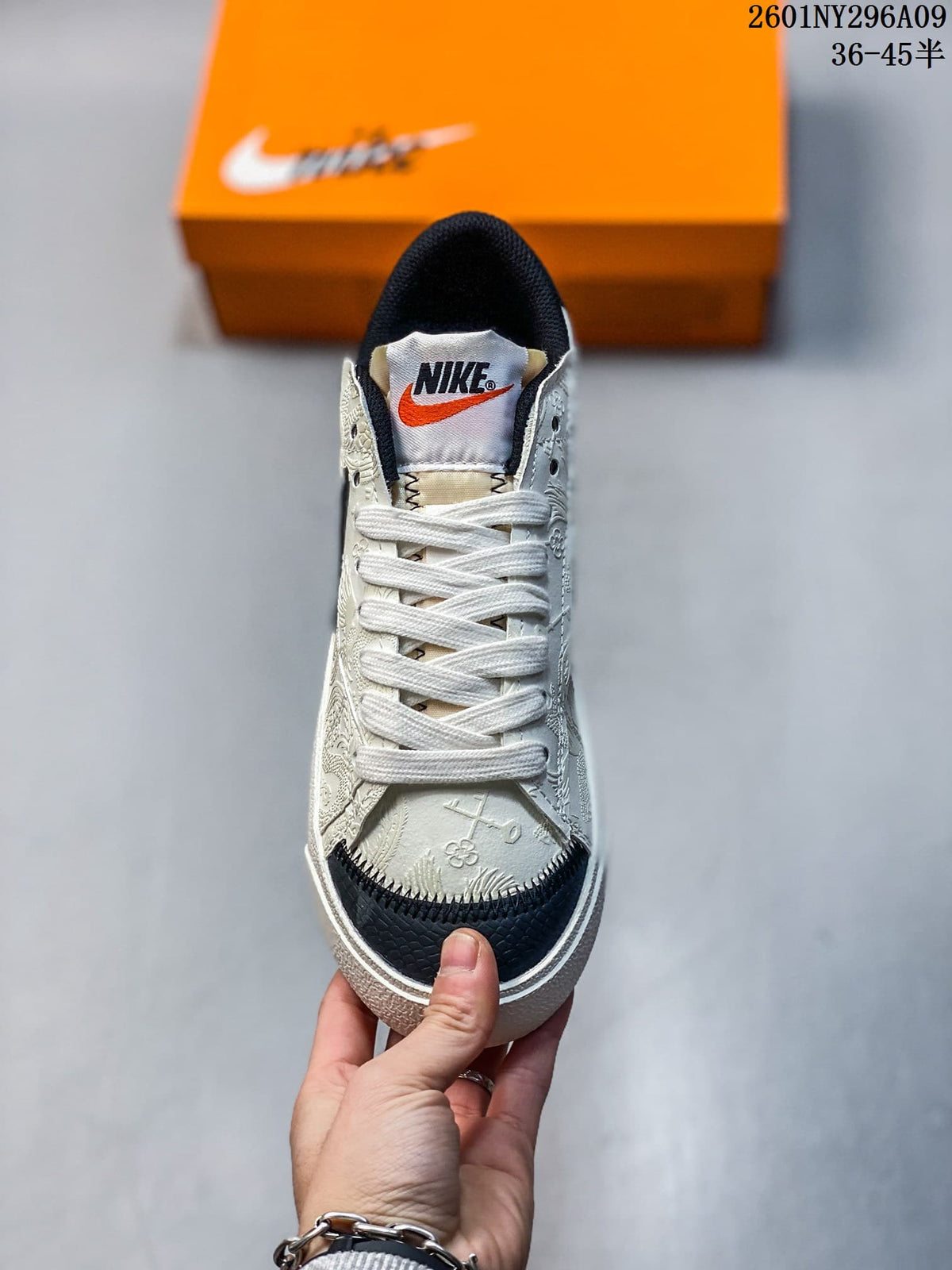 Front view highlighting the white laces, patterned panels, and black textured toe detail