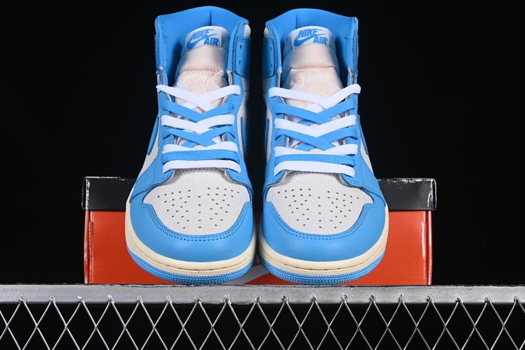 Front view of the pair of blue-and-white high-top sneakers