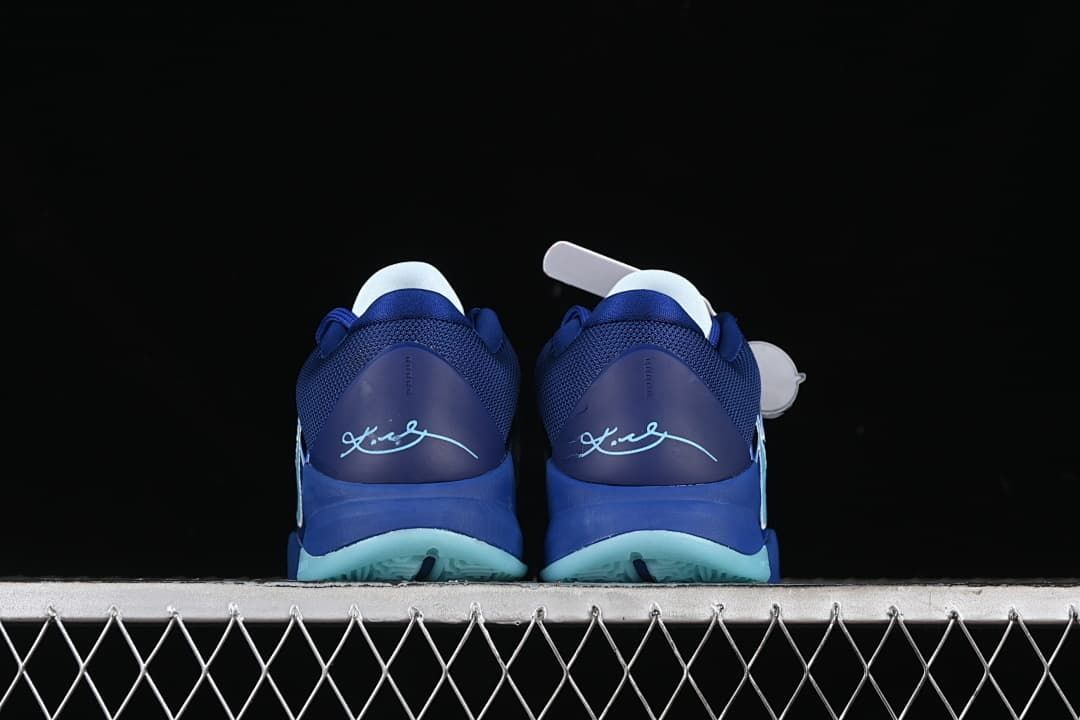 Rear view of the pair with heel details and aqua outsole