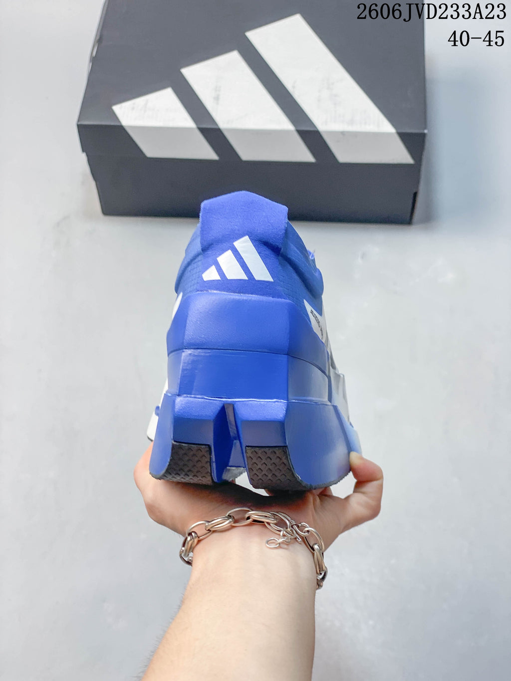 Rear view showing the blue heel and outsole.