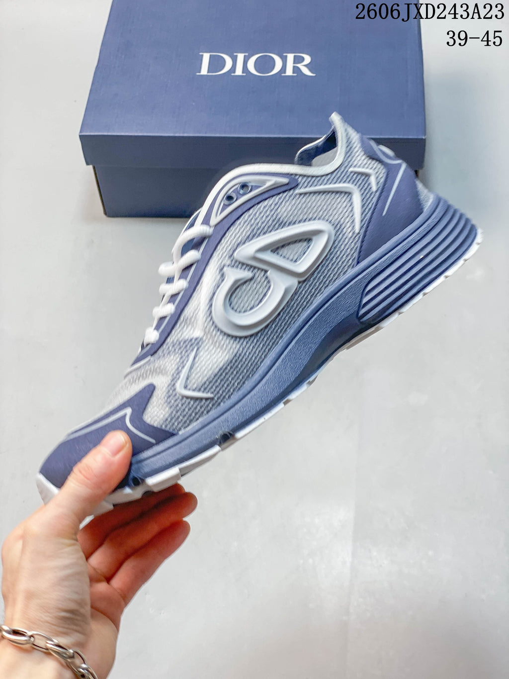 Side view of the sneaker showing its mesh-style upper and raised side details