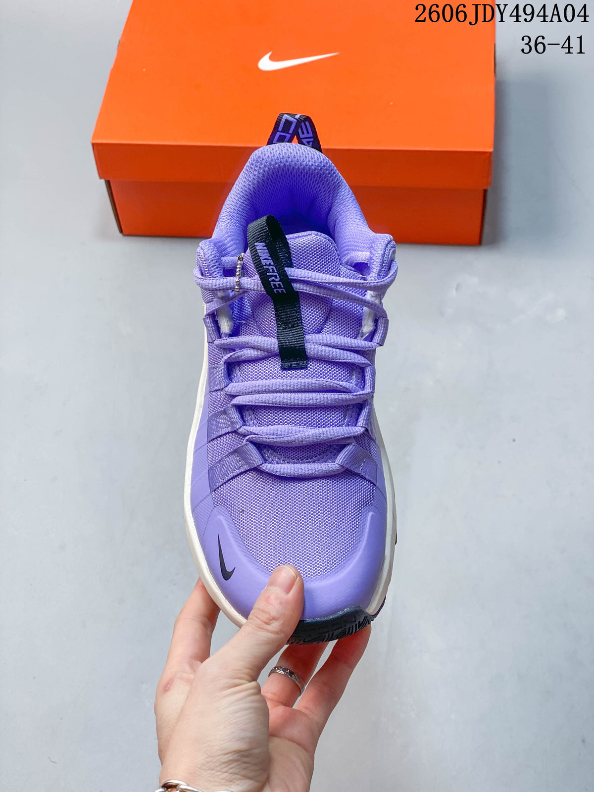 Front view highlighting the mesh upper and lace-up closure of the purple training shoe.