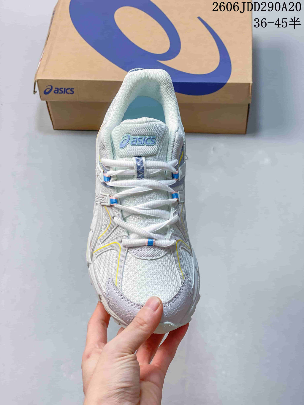 Top-down view of the shoe showing its laces, tongue, and light-colored upper.