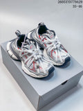 Pair of white, silver, and red Balenciaga Phantom sneakers shown from above on a shoebox.